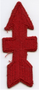 Embroidered red arrow pointing up with a bar in the middle of the arrow and entending from side-to-side. This was the official patch worn by members of the 32nd Infantry Division, the Red Arrow Men, in WWII.